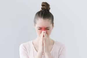girl having symptoms of chronic sinusitis disease